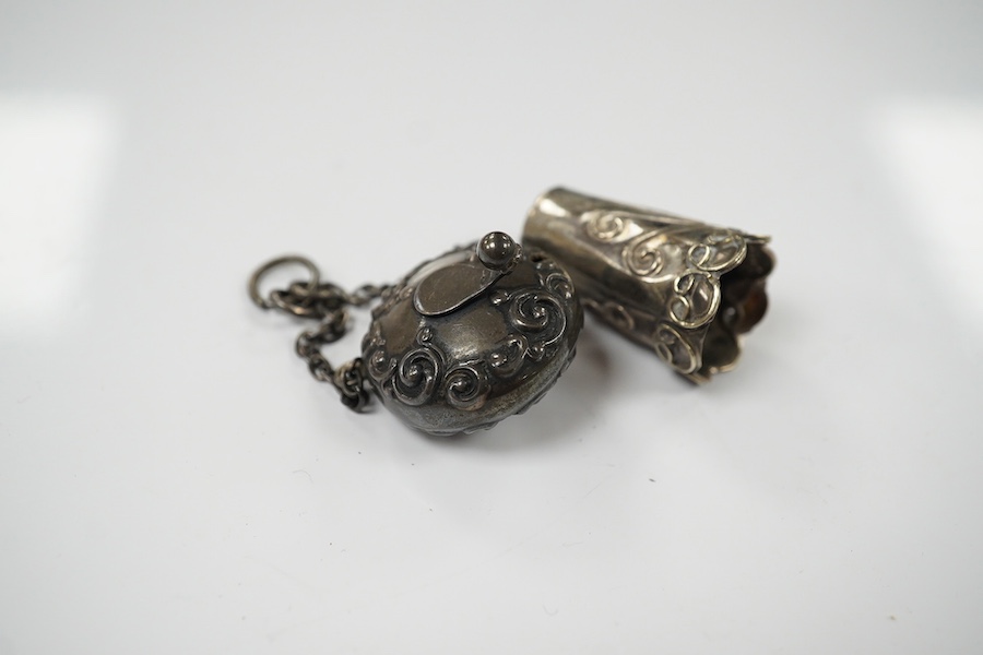 A late Victorian silver tape measure case, Birmingham, 1898, 25mm, with suspension chain and a white metal thimble. Condition - poor to fair